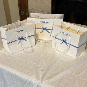 Tiff's Treats White Gift Bags with Blue Ribbon